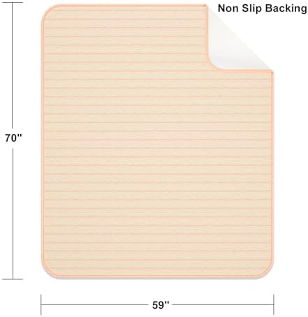 Kelisiting bed pad being used on a sofa for furniture protection