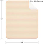 Kelisiting bed pad being used on a sofa for furniture protection