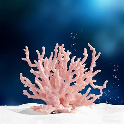 Artificial coral reef decoration providing shelter for small aquarium fish.