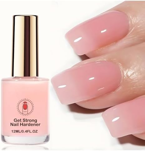 Close up of nail strengthener bottle with sheer pink liquid