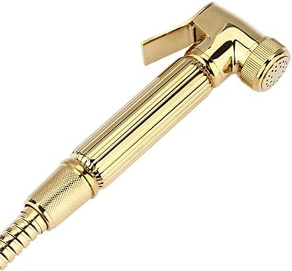 Close up of ergonomic fluted handle on gold bidet sprayer