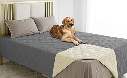 Ameritex waterproof pet cover draped over a stylish living room sofa corner.