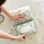 Tiny Twinkle Sage Checkers print compact diaper changing mat ideal for newborn shower gifts.