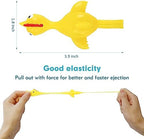 Sixteen individual yellow novelty finger flingers laid out in rows showing the complete party pack