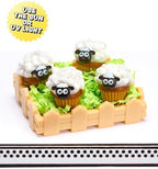 Completed miniature Bunny Cake and Deviled Eggs resin food replicas on display tables