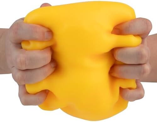 Extra large durable thermoplastic rubber yellow cheese block returning to its original shape
