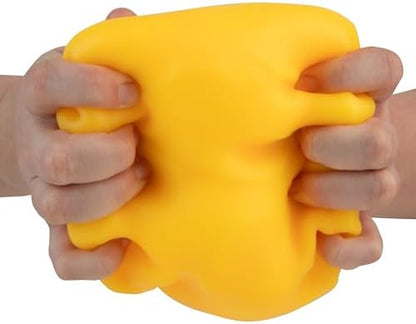 Extra large durable thermoplastic rubber yellow cheese block returning to its original shape