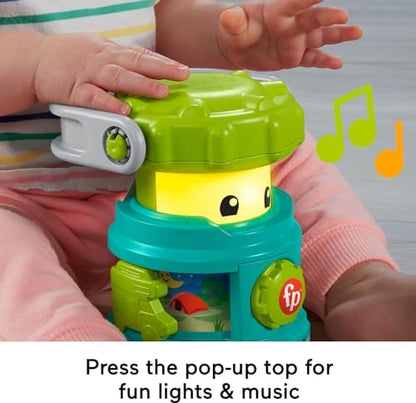 Close up of the dial and pop up top on the Fisher Price camping toy.