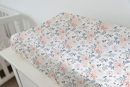 TotAha imported cotton rayon blend floral print cover fitted securely over a changing mattress