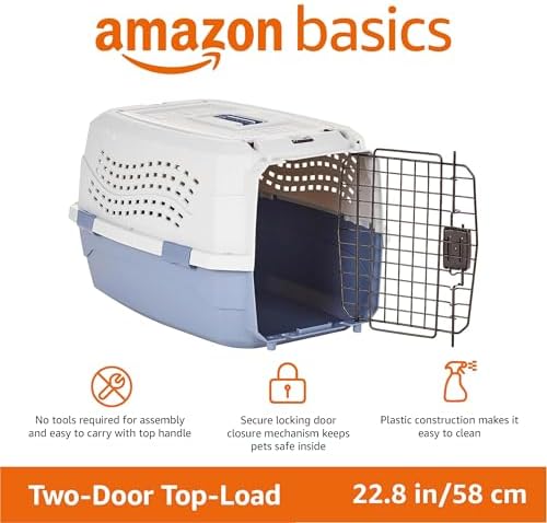 Gray and blue hard sided pet crate showing the ventilation holes on the side and back panel
