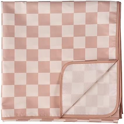 Tiny Twinkle eco friendly splat mat showing the premium safety certification tag and durable stitching