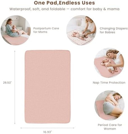 Konssy waterproof baby changing mat spread out on a bed showing its full coverage area.