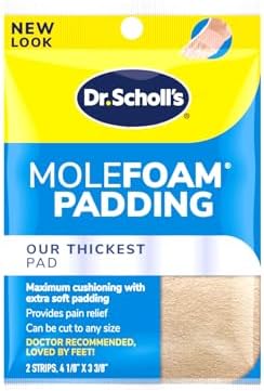 Close up of Dr. Scholl's adhesive foam padding being cut to size with scissors.