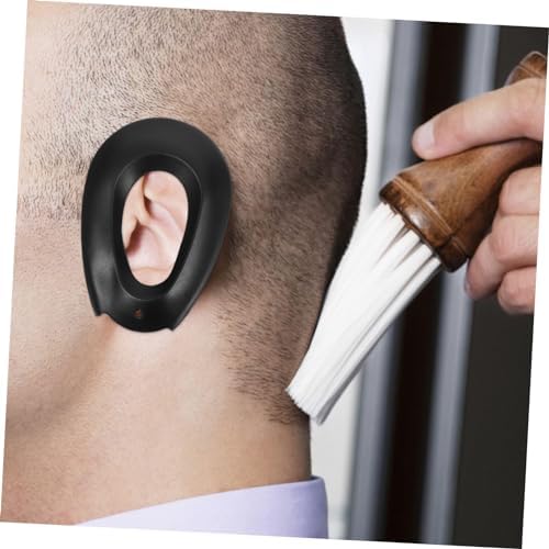 Gatuida silicone ear protectors being used during a hair dyeing process.
