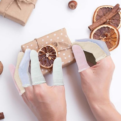 Breathable cotton fingertip protectors spread out in random vibrant colors.