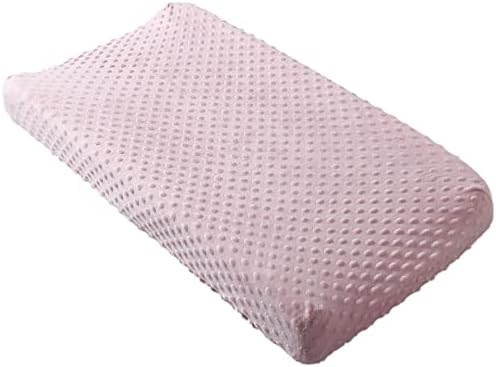 Close up shot of the skin friendly minky dots texture on the breathable baby table sheet.