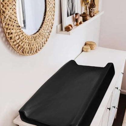Black liquid resistant baby changing station protector close up texture.