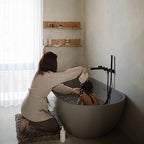 Mushie bath rinse cup showing textured grip detail