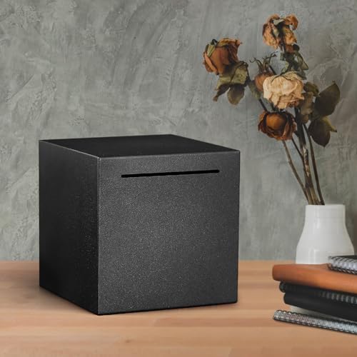Lifestyle shot of the minimalist metal cash locker sitting elegantly on a modern office desk as home decor.