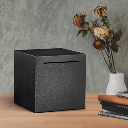 Lifestyle shot of the minimalist metal cash locker sitting elegantly on a modern office desk as home decor.
