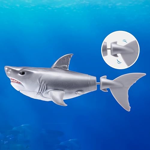 Two Robo Alive robotic sharks swimming in water bath toy