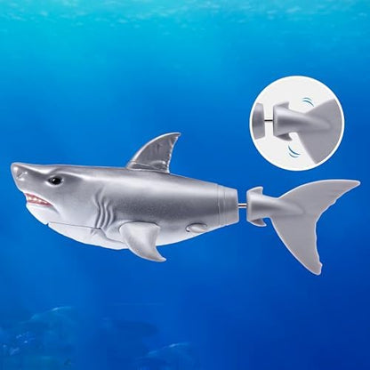 Two Robo Alive robotic sharks swimming in water bath toy