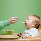Close up of the shallow bowl design on the gum friendly silicone infant weaning spoon.