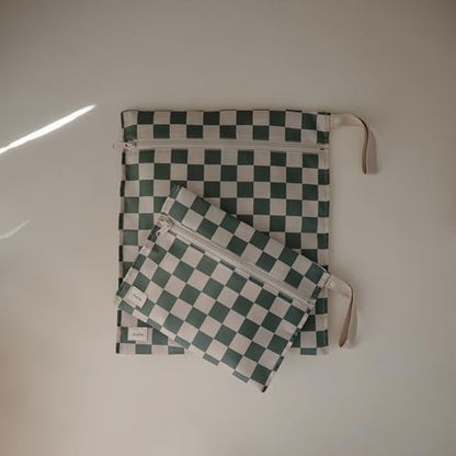 Two sizes of mushie reusable wet storage bags displayed together