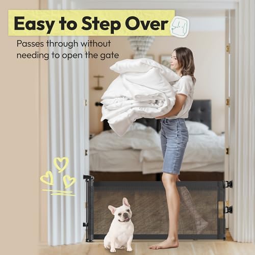 Black mesh low pet barrier extended across hallway stairs step over