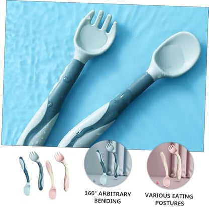 Pink and blue bendable infant spoon and fork cutlery close up