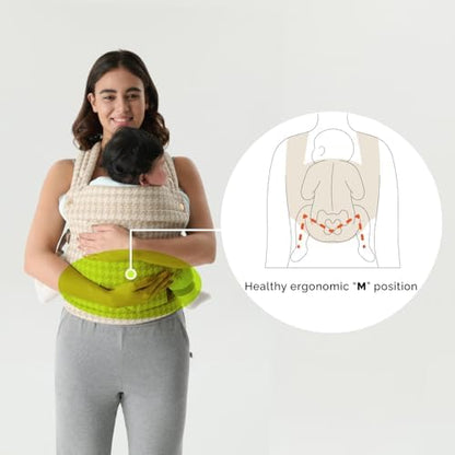 Parent demonstrating hands-free use of Nest Blanche carrier