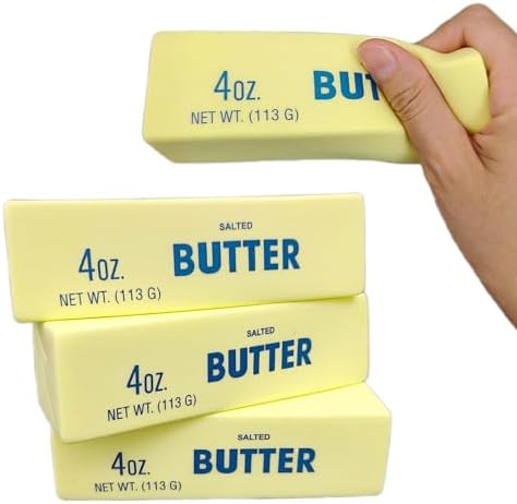 YOXIER squishy butter toy being compressed by a hand to demonstrate the soft slow rebound foam texture.