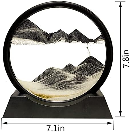 Rotating sand art display showing mountain landscape effect.