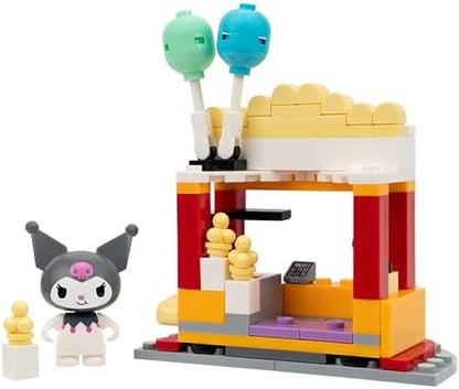 Kuromi and Chococat poseable figures sitting at the umbrella picnic table