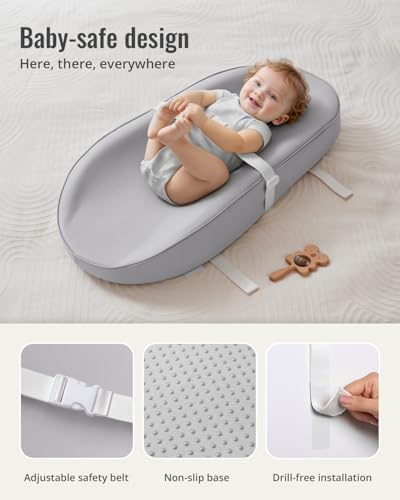 Light gray vegan leather baby changing pad placed on a nursery dresser top.