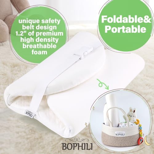 Bophili baby changing station pad showing integrated security strap