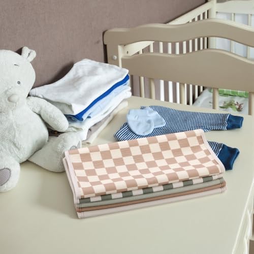 Folded portable baby changing mats packed for travel and storage