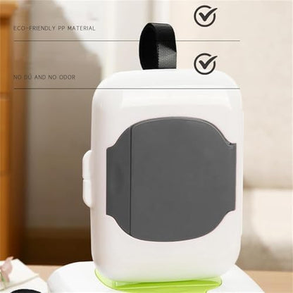 Gray travel wipe holder attached to a baby stroller