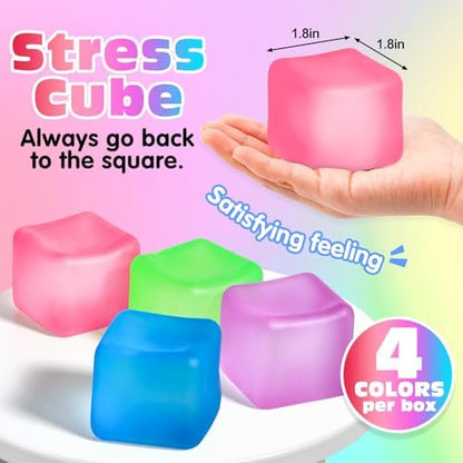 Four pieces of square shape nice cube fidget toys in blue green purple and pink resting on a flat surface.