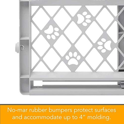 Lightweight expandable pet barrier being adjusted to fit a wide hallway opening without tools.