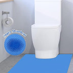 Miumoon blue disposable toilet mat placed neatly on a modern bathroom floor around the toilet bowl.