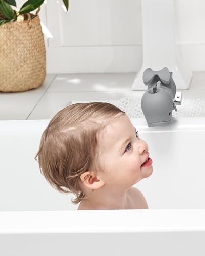 Skip Hop whale spout cover installed on bathtub faucet