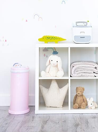 Ubbi light pink diaper pail featuring childproof safety lock detail