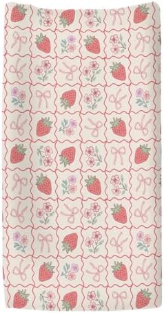 Close up detail of strawberry and checkerboard print on changing pad sheet