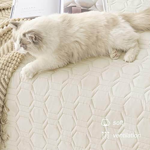 Tcksstex ivory pet mat being placed onto a large bedroom mattress.