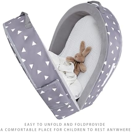 Mooedcoe lightweight kids travel couch and sleeping cot alternative placed flat on a bedroom floor.