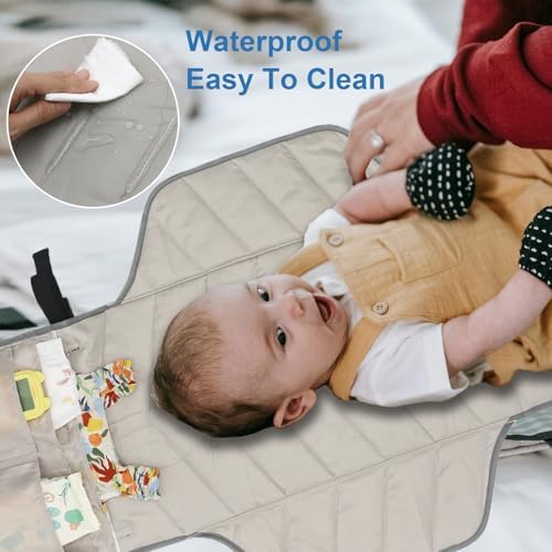 Outtip wipeable reusable diaper mat shown inside a travel diaper bag