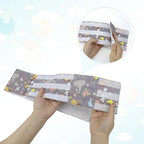 Soft breathable cotton feeding tube holder belt laid flat to show adjustable extension straps.