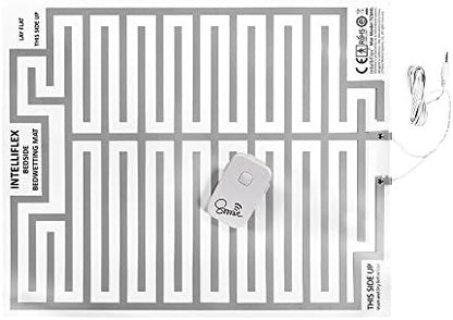 Demonstration of the bedwetting alarm mat placed under a standard bedsheet.