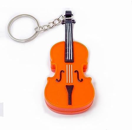MunnyGrubbers tiny mini violin replica held in hand to illustrate its pocket-sized novelty dimensions.